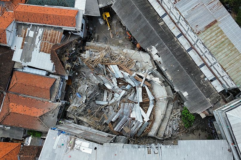 An aerial shot shows the rubble of a building that collapsed at the compound of an Islamic boarding school in Sidoarjo, East Java, Indonesia, Tuesday, Sept. 30, 2025. 