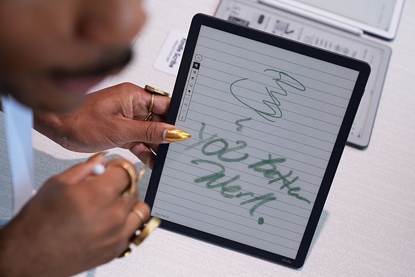 People test out the new Kindle Scribe Colorsoft at an Amazon event in New York, Tuesday, Sept. 30, 2025. 