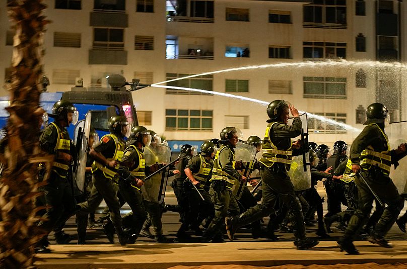 Security forces disperse a gathering as youth led protests calling for healthcare and education reforms turned violent, in Sale, Morocco, Wednesday, Oct. 1, 2025. 