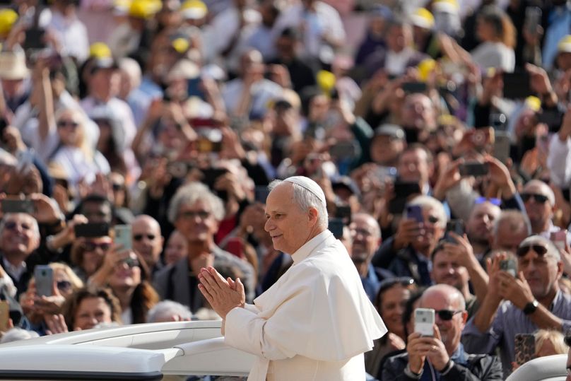 Pope Leo XIV gestures as he arrives for his weekly general audience in St. Peter's Square at The Vatican, Wednesday, Oct.1, 2025