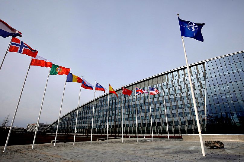 Flags of NATO alliance members outside NATO headquarters in Brussels, 28 February, 2020