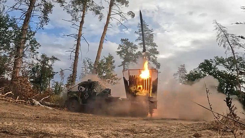 A Russian "Grad" self-propelled 122 mm multiple rocket launcher fires towards Ukrainian positions on an undisclosed location in Ukraine, 2 October, 2025