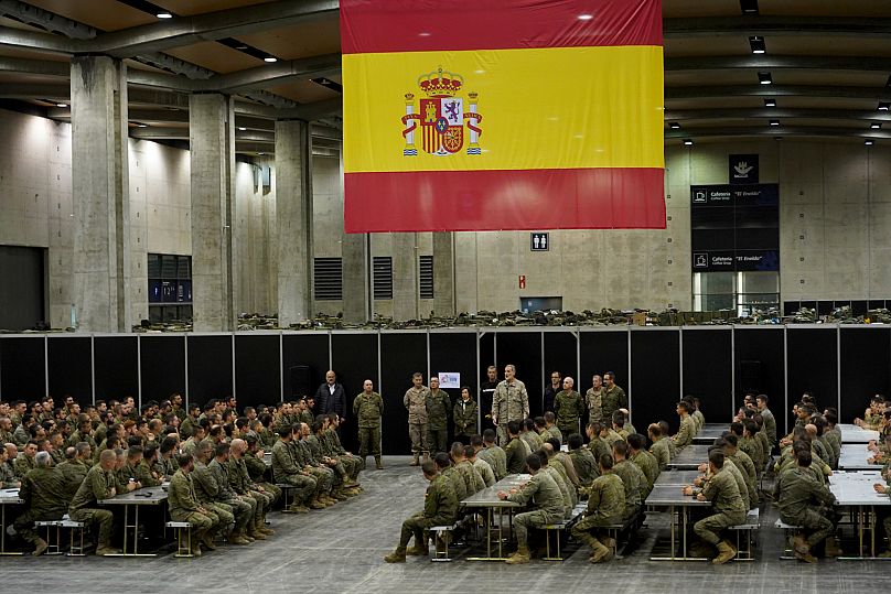Spain's King Felipe VI speaks to the troops at a military base on the outskirts of Valencia, 12 November, 2024