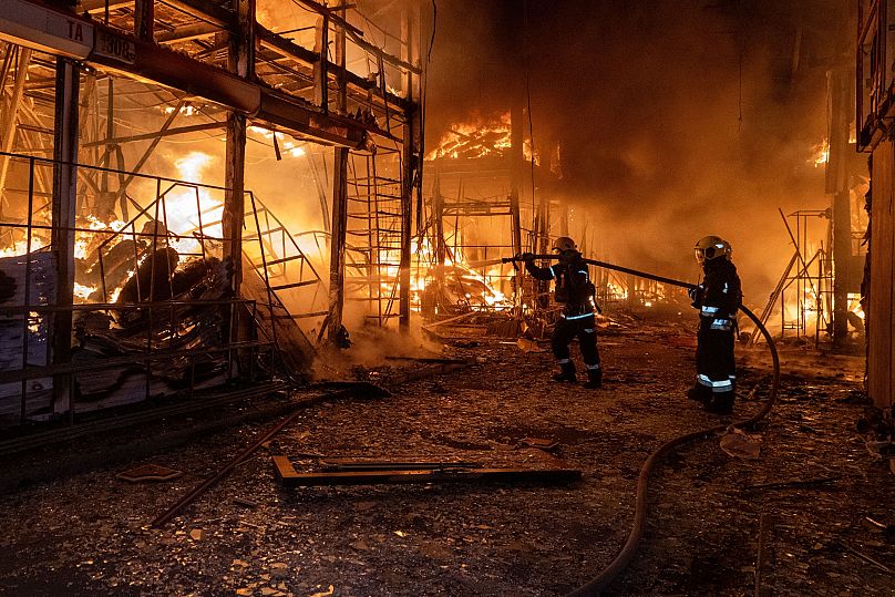 Firefighters tackle the blaze after a Russian air attack that hit at Barabashovo market in Kharkiv, 1 October, 2025