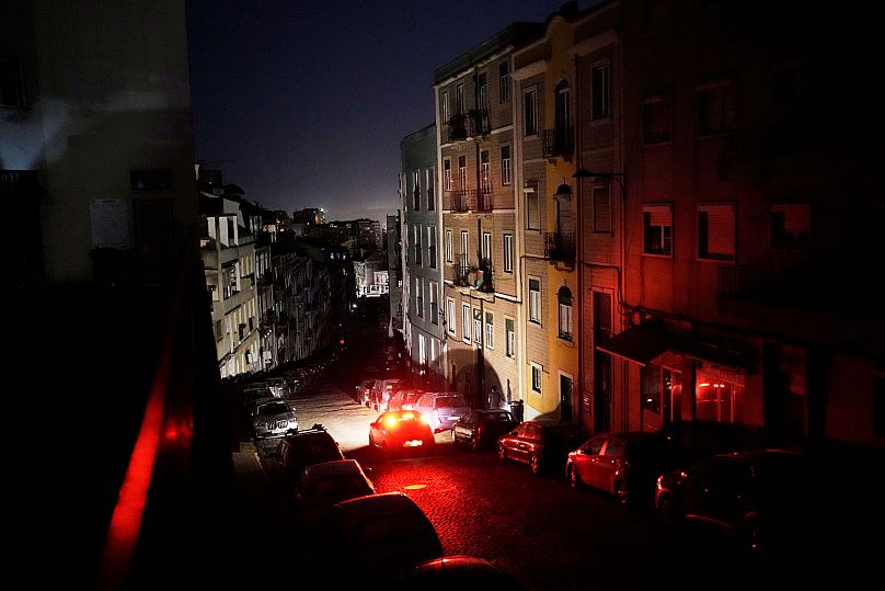 FILE: A car drives down an unlit street in Lisbon, during a nationwide power outage, 28 April 2025