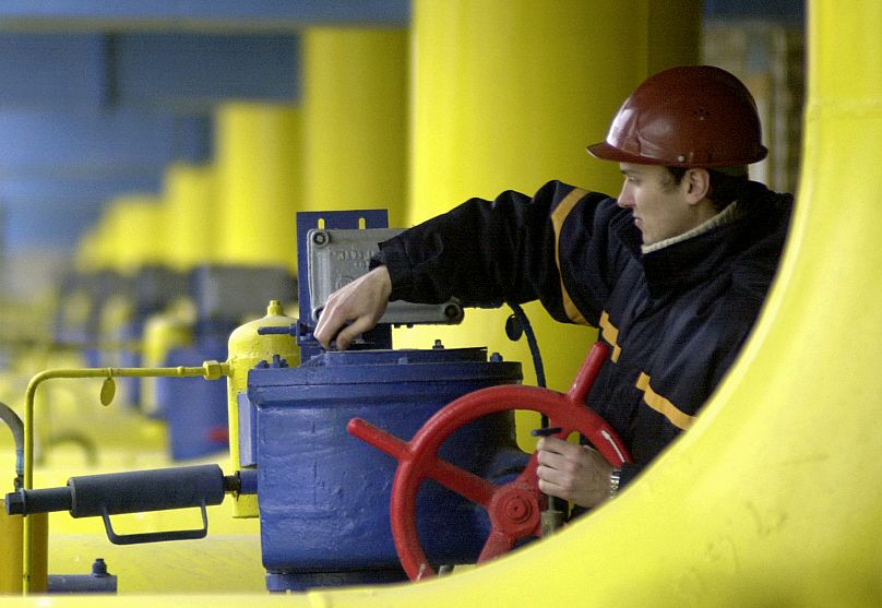A Ukrainian worker operates valves in a gas storage and transit point in Boyarka, 3 January, 2006