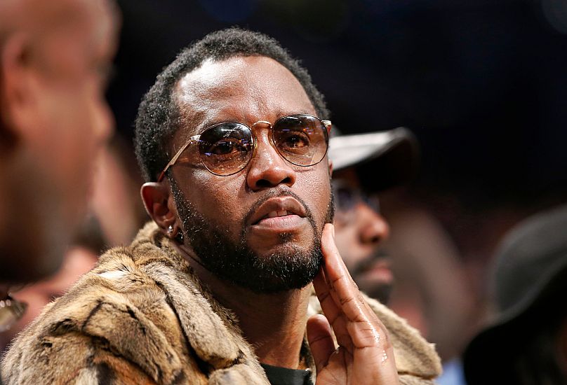 Sean "Diddy" Combs sits courtside in the second half of an NBA basketball game between the Brooklyn Nets and the New York Knicks, 12 March, 2017