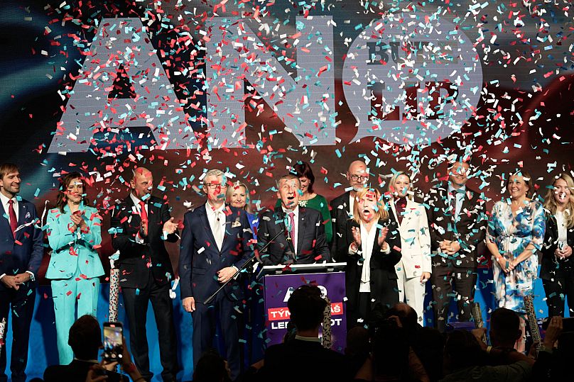 Confetti fall as the Chairman of opposition "ANO" (YES) movement Andrej Babis addresses the media after most of the votes were counted in the parliamentary elections in Prague