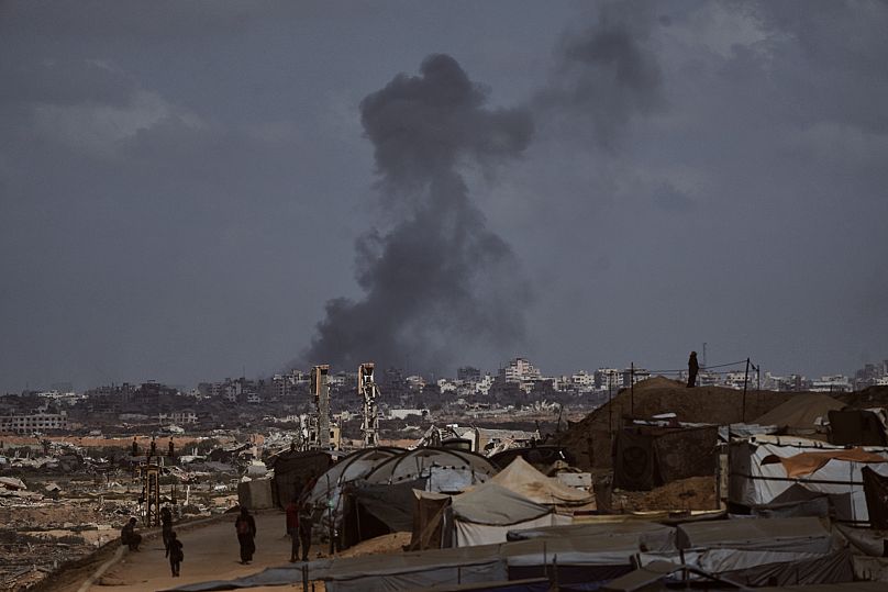 Smoke rises following an Israeli military strike in Gaza City, as seen from the central Gaza Strip, Sunday, Oct. 5, 2025.