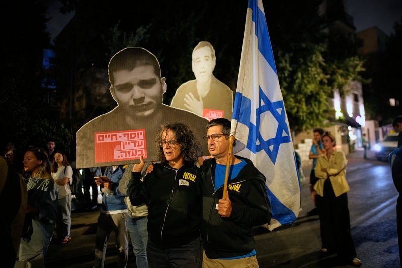People attend a protest outside the Prime Minister's residence calling for the release of all hostages held by Hamas in Gaza and urges a ceasefire, Sunday, Oct. 5, 2025