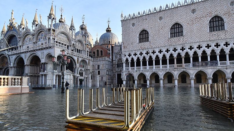 Trestle bridges are piled up in a flooded St. Mark's Square during a high tide of 1.44 meters (4.72 feet), in Venice, Italy, Monday, Dec. 23, 2019