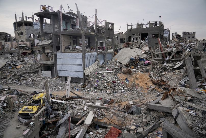 Ruins of apartments destroyed by Israeli strikes litter the area next to Khaled Nassar's home in the Jabaliya refugee camp in Gaza City Feb. 9, 2025