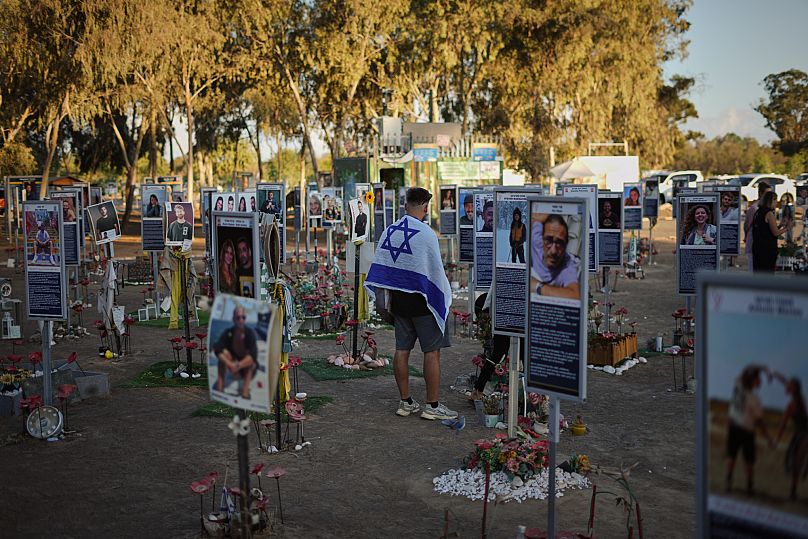 People visit the site of the Nova music festival, where hundreds of revelers were killed and abducted by Hamas and taken into Gaza, southern Israel, Tuesday, Oct. 7, 2025. 
