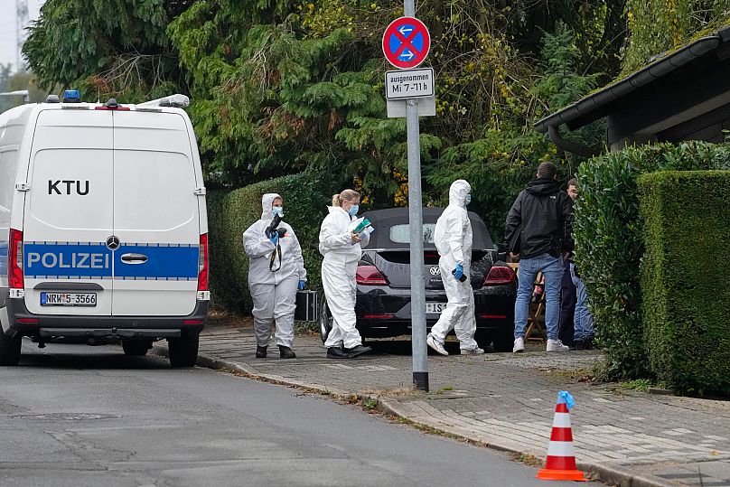 Forensic investigators appear at the crime scene at a street in Herdecke, 7 October, 2025