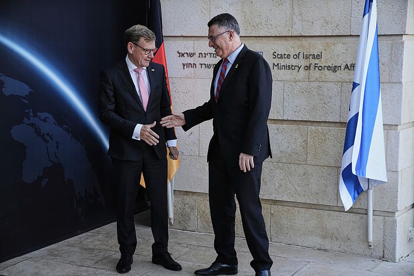 Israel's Foreign Minister Gideon Sa'ar, right, welcomes his German counterpart Johann Wadephul in Jerusalem, Thursday, July 31, 2025. (AP Photo/Leo Correa)