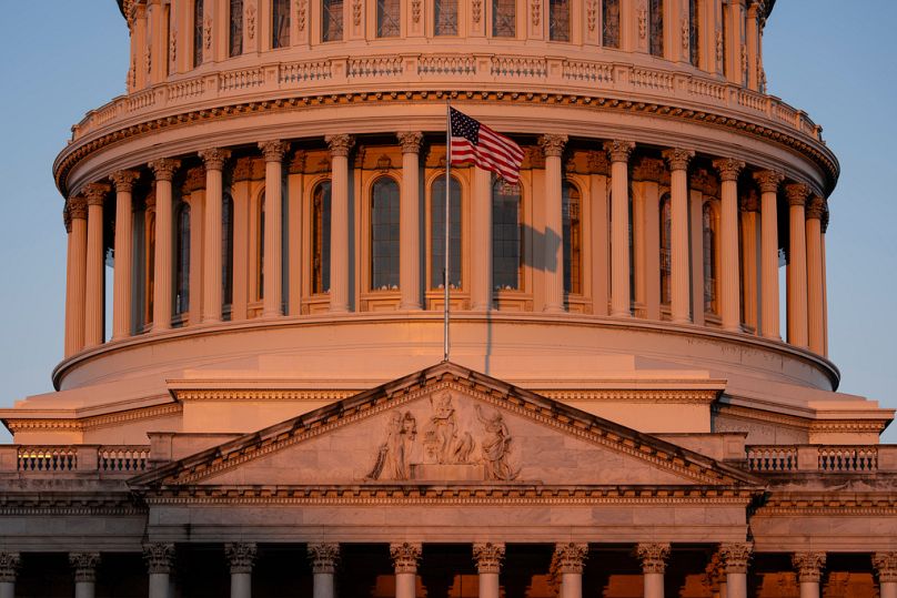 The US Capitol is illuminated at dawn in Washington, Monday, Oct. 6, 2025