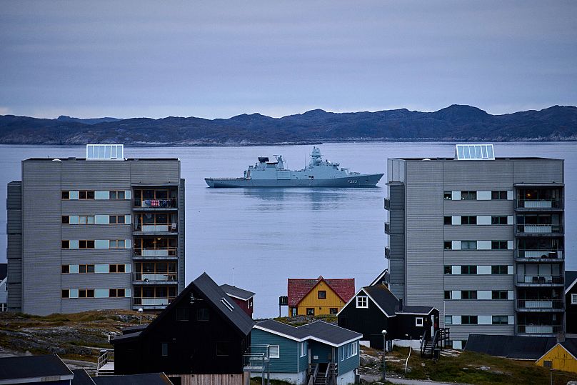 FILE: A warship passes by houses on the day of a military exercise with hundreds of troops from several European NATO members in the Arctic Ocean in Nuuk, 15 September 2025