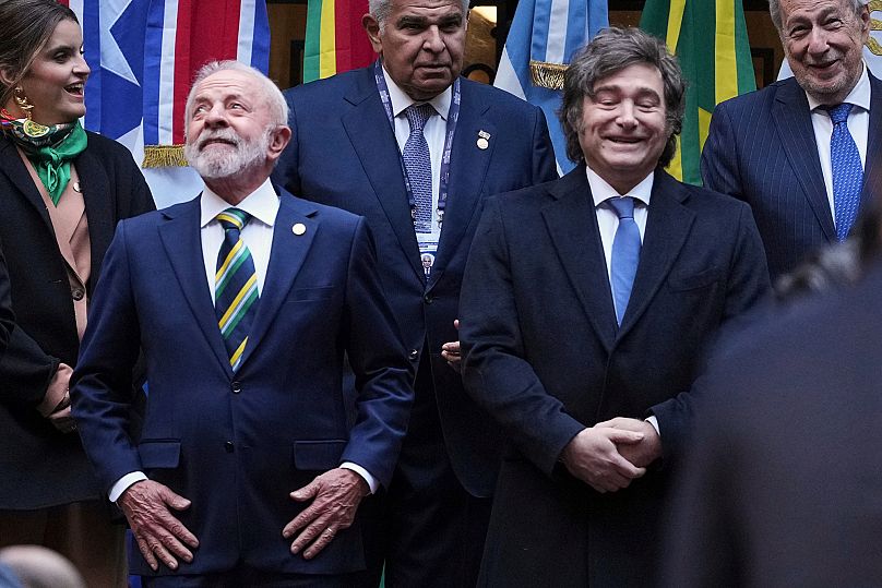 FILE: Brazil's President Luiz Inacio Lula da Silva and Argentina's Javier Milei stand for a group photo with other leaders at the Mercosur Summit in Buenos Aires, 3 July 2025