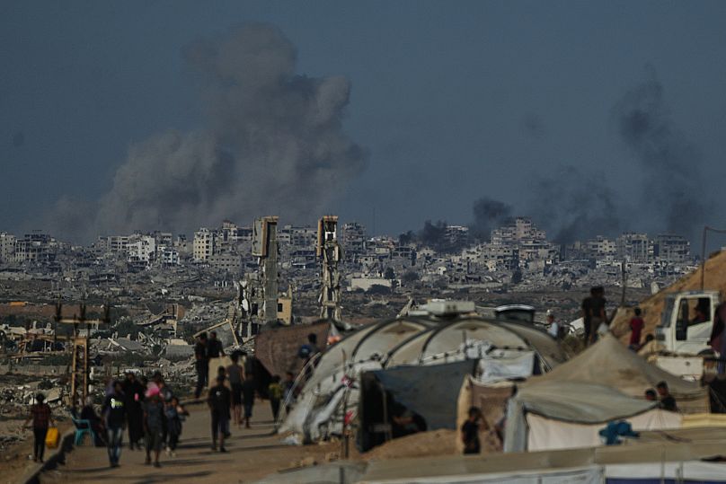 Smoke rises following an Israeli military strike in Gaza City as seen from the central Gaza Strip, 8 October, 2025