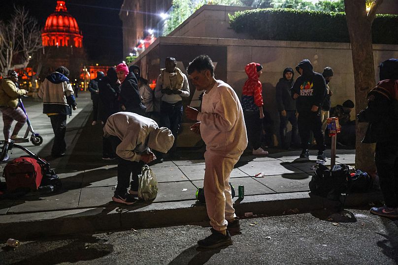 Drug users and dealers are seen outside the Asian Art Museum on Hyde Street in San Francisco, 13 March, 2024