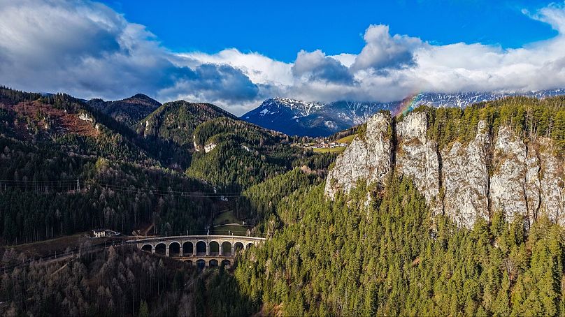 Scenic views of mountains and a viaduct on the Semmering Railway.