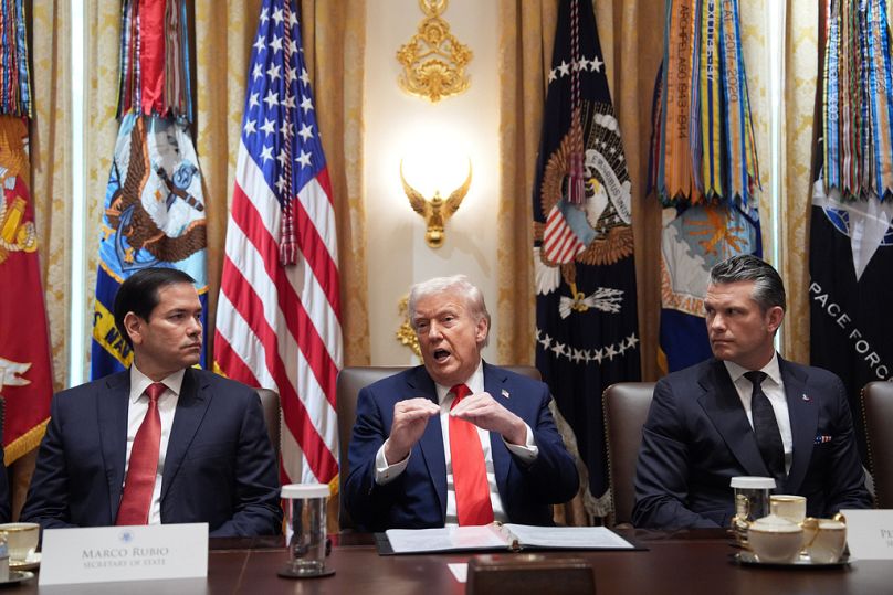 Trump speaks during a cabinet meeting at the White House as State Secretary Marco Rubio and Defence Secretary Pete Hegseth listen, in Washington,Thursday, Oct. 9, 2025