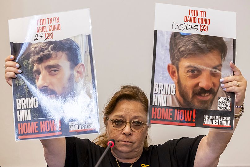 Silvia Cunio mother of the hostages Ariel Cunio, left, and David Cunio, right, at the European headquarters of the United Nations in Geneva, Switzerland, Aug. 12, 2025.