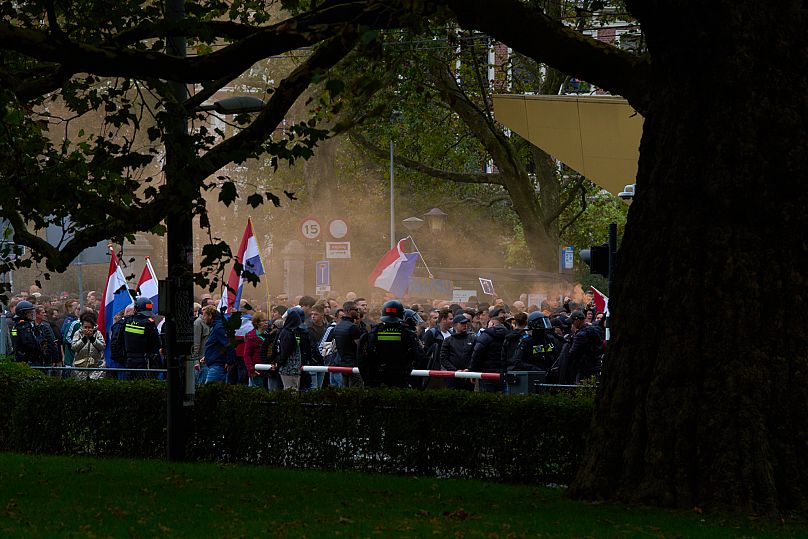 Anti-immigration protesters march during a demonstration in Amsterdam, Netherlands, Sunday, Oct. 12, 2025.