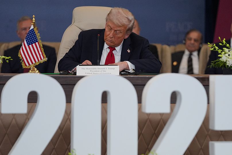 US President Donald Trump signs a document in Sharm El Sheikh, 13 October, 2025