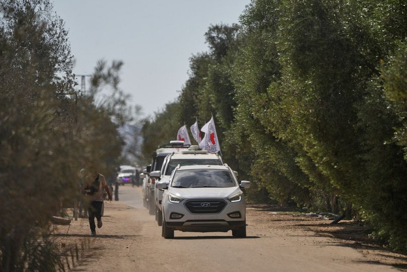 ICRC vehicles transporting released Israeli hostages head toward the Israeli border in Khan Younis, southern Gaza Strip, Monday, Oct. 13, 2025.