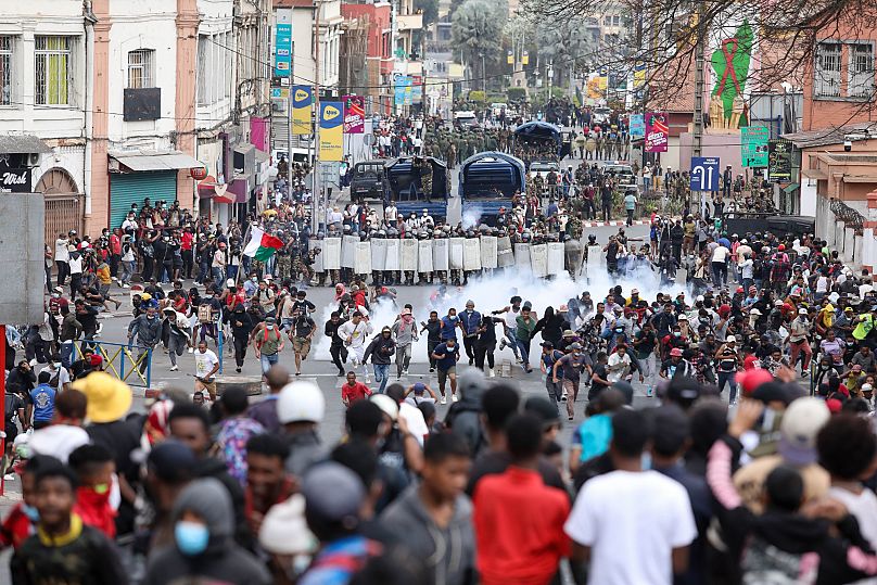 Demonstrators protesting against chronic electricity and water cuts confront riot police in Antananarivo, Madagascar, Tuesday, Sept. 30, 2025. 
