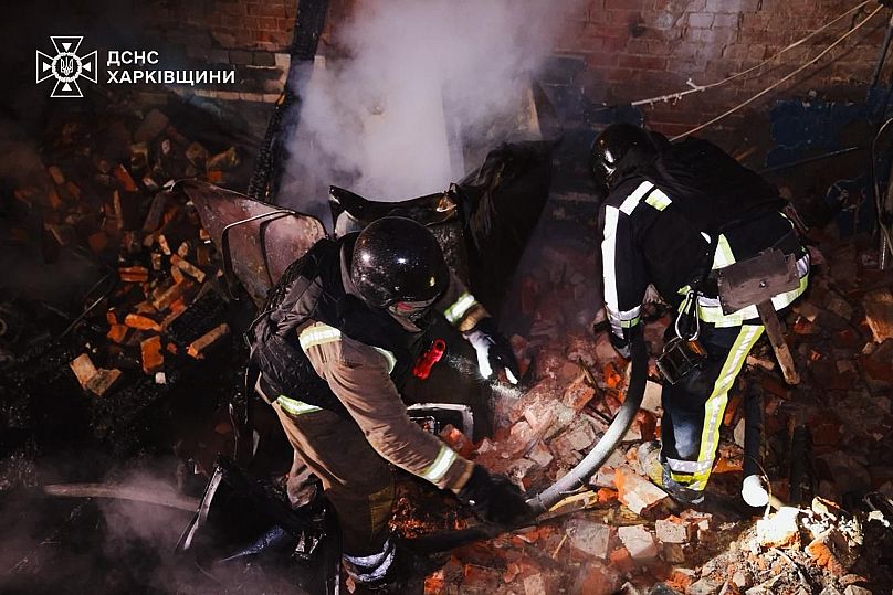 Rescue workers put out a fire of a hospital damaged by a Russian strike in Kharkiv, 14 October, 2025