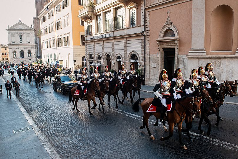Mounted cuirassiers escort Pope Leo XIV as he arrives in a car at the Quirinal Palace in Rome, 14 October, 2025