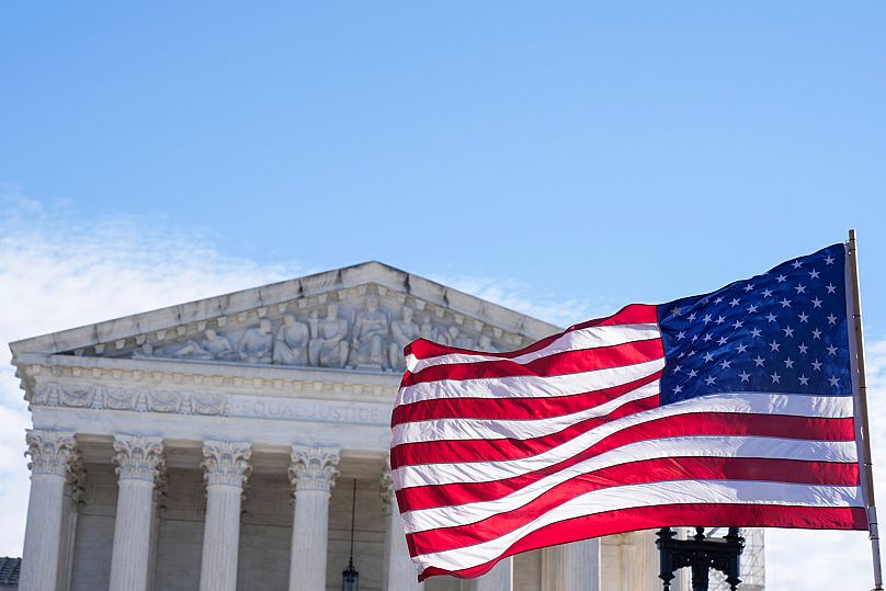 The US flag flies in front of the Supreme Court in Washington, 4 December, 2024