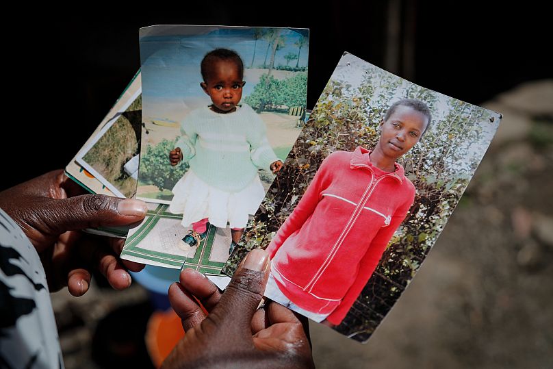 Rose Wanyua Wanjiku, elder sister to Agnes Wanjiru holds photographs of Agnes in Nanyuki, Kenya, 4 November 2021