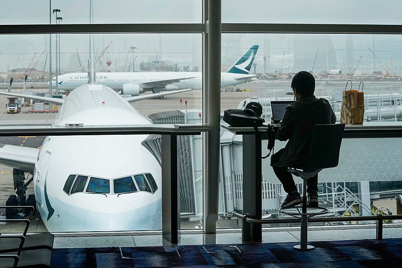 A Cathay Pacific plane at the departures hall of Hong Kong International Airport in Hong Kong, 10 February, 2023