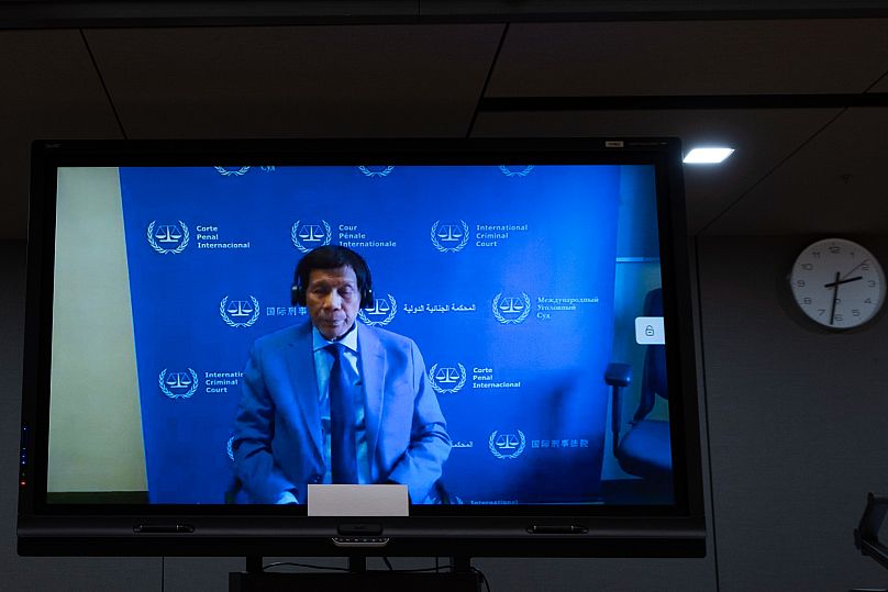 Former Philippine President Rodrigo Duterte is seen on a screen in the courtroom of the International Criminal Court in The Hague, 14 March, 2025