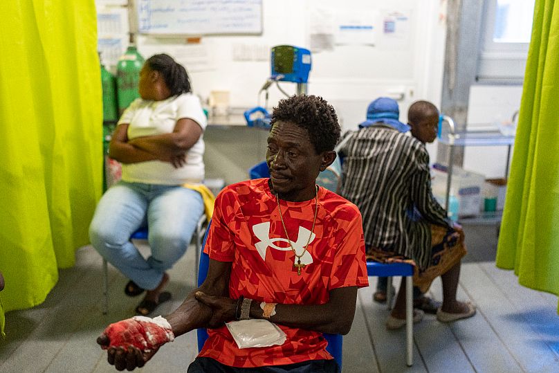 A man waits to be treated for a bullet wound at a Doctors Without Borders emergency room in the Cite Soleil neighbourhood of Port-au-Prince, 19 April, 2024
