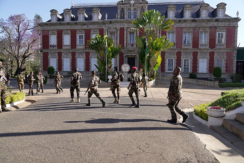 Troops loyal to CAPSAT military unit commander Col. Michael Randrianirina arrive at the presidency to announce that the armed forces are taking control of the country in Antan