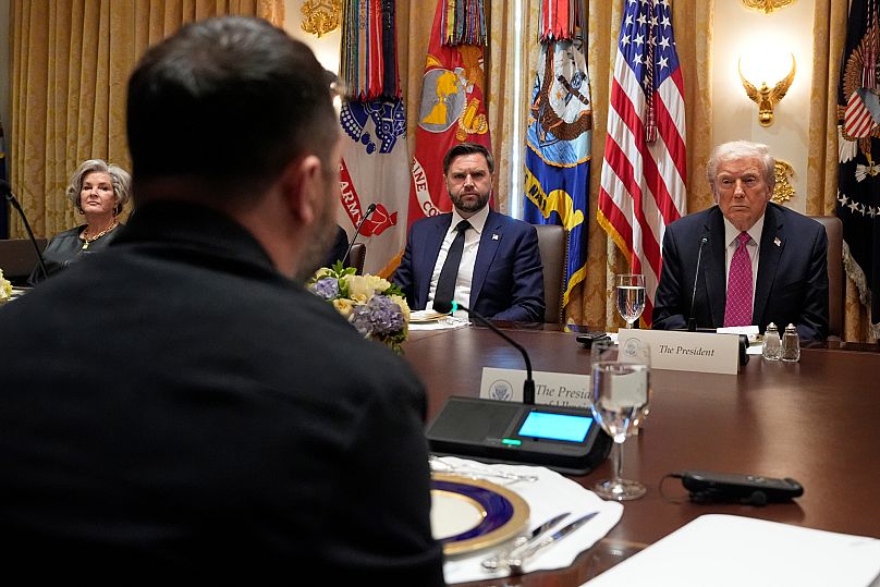 Donald Trump attends a lunch with Volodymyr Zelenskyy in the Cabinet Room of the White House, Friday, Oct. 17, 2025, in Washington.