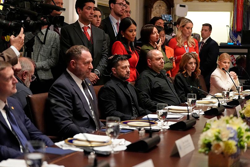 Ukraine's President Volodymyr Zelenskyy, seated third from left, listens as President Donald Trump speaks before a lunch in the Cabinet Room of the White House, Oct. 17, 2025