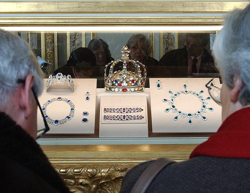 Some of the French Crown Jewels, including the diamond crown of King Louis XV and Empress Marie-Louise's necklace,in the Apollo Gallery of the Louvre, Nov. 23, 2004.