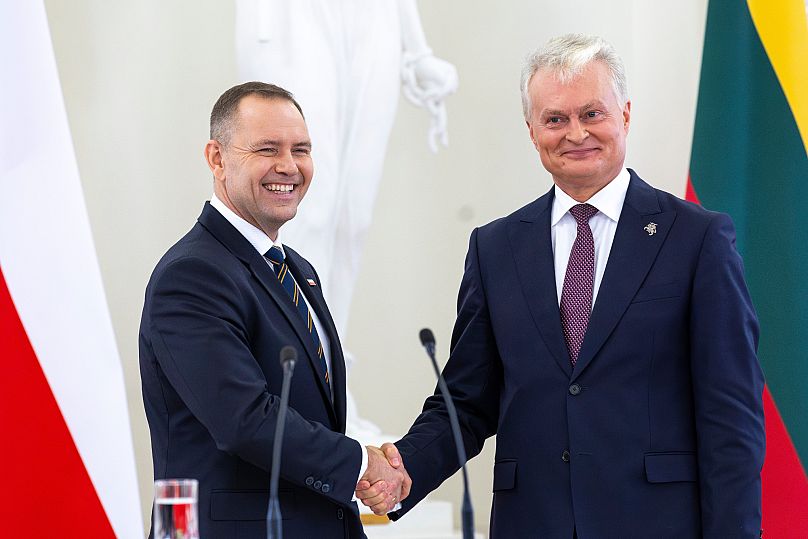 Polish President Karol Nawrocki, left, shakes hands with Lithuania's President Gitanas Nausėda after a press conference in Vilnius, 8 September, 2025
