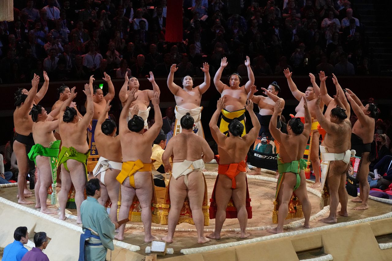 Sumo wrestlers celebrate the opening on the dohyo, the sacred sumo wrestling ring, during The Grand Sumo Tournament at the Royal Albert Hall in London. 