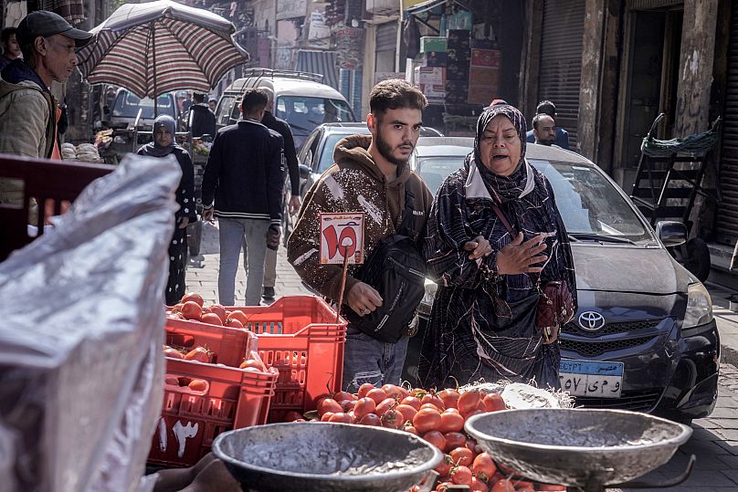 People walk at a popular market in Cairo, 5 November, 2024