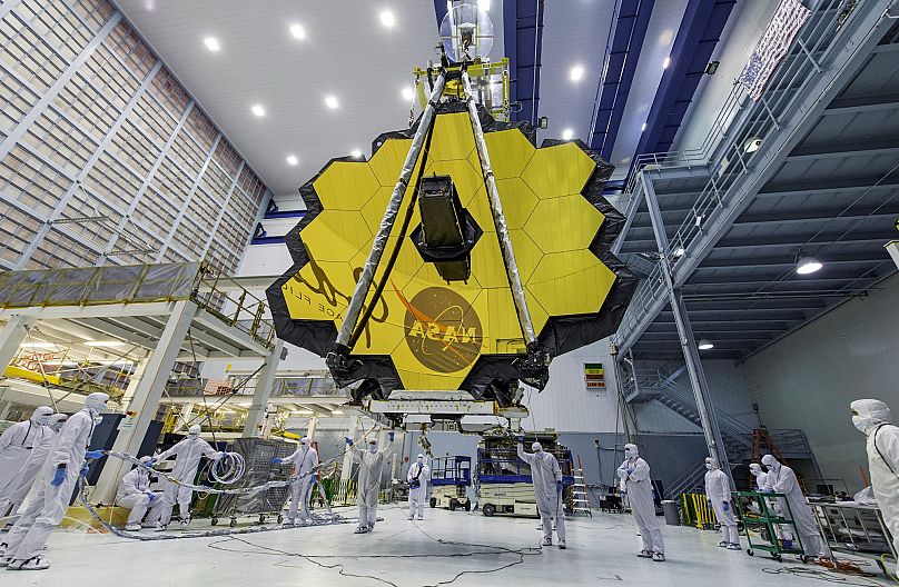 Technicians lift the mirror of the James Webb Space Telescope using a crane at the Goddard Space Flight Center in Greenbelt, Md (2017). 