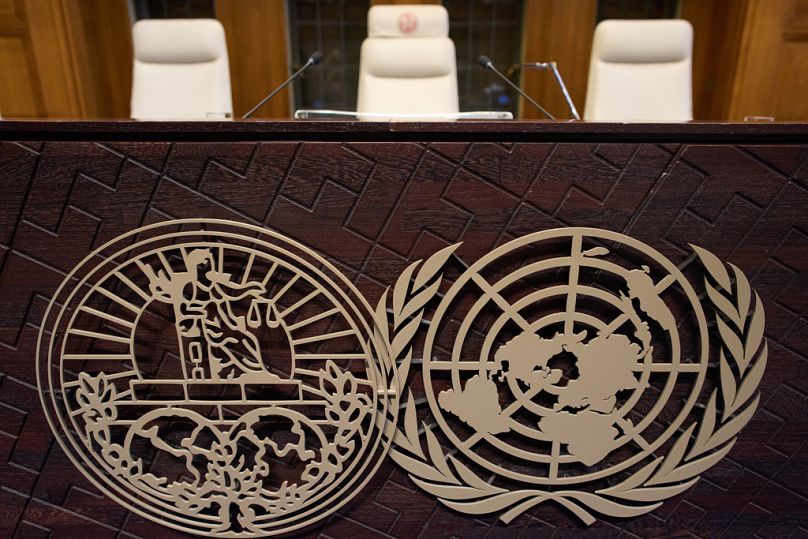 The seat of Presiding Judge Yuji Iwasawa, center, and the World Court logo are seen prior the reading of the advisory opinion of the ICJ, The Hague, Wednesday, Oct. 22, 2025
