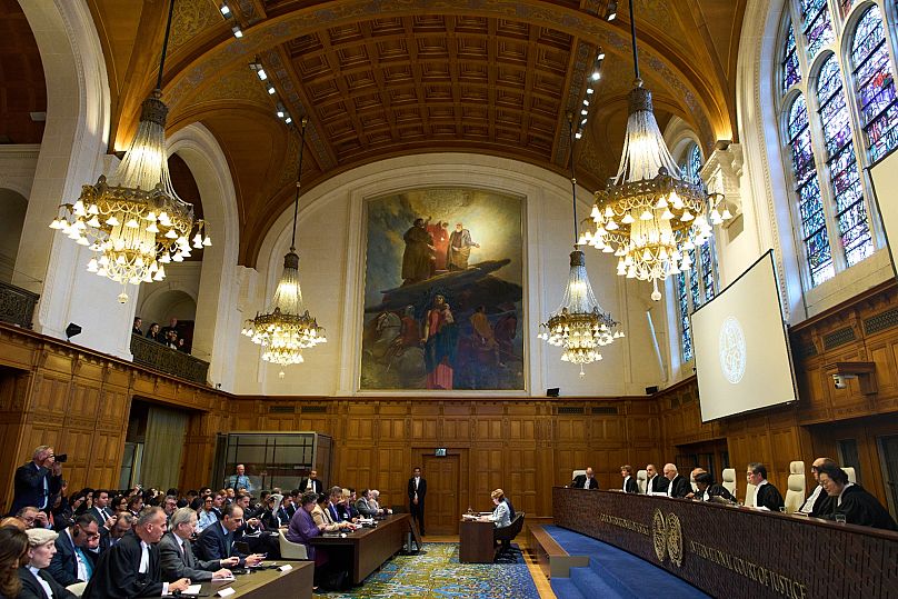 Presiding Judge Yuji Iwasawa, third from right, starts reading the ICJ advisory opinion in The Hague, 22 October, 2025