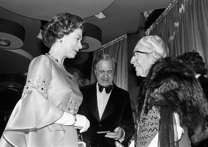  Agatha Christie, 84, greets Queen Elizabeth II at the premiere of the film Murder On The Orient Express - 1974