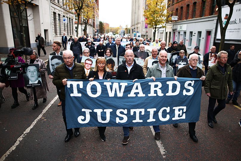 Relatives and supporters of the victims of the 1972 Bloody Sunday massacre march to Belfast Crown Court, 23 October, 2025